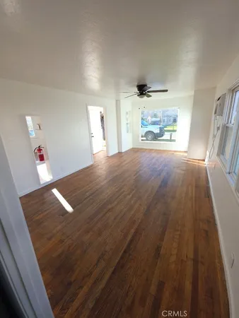 a view of kitchen and empty room
