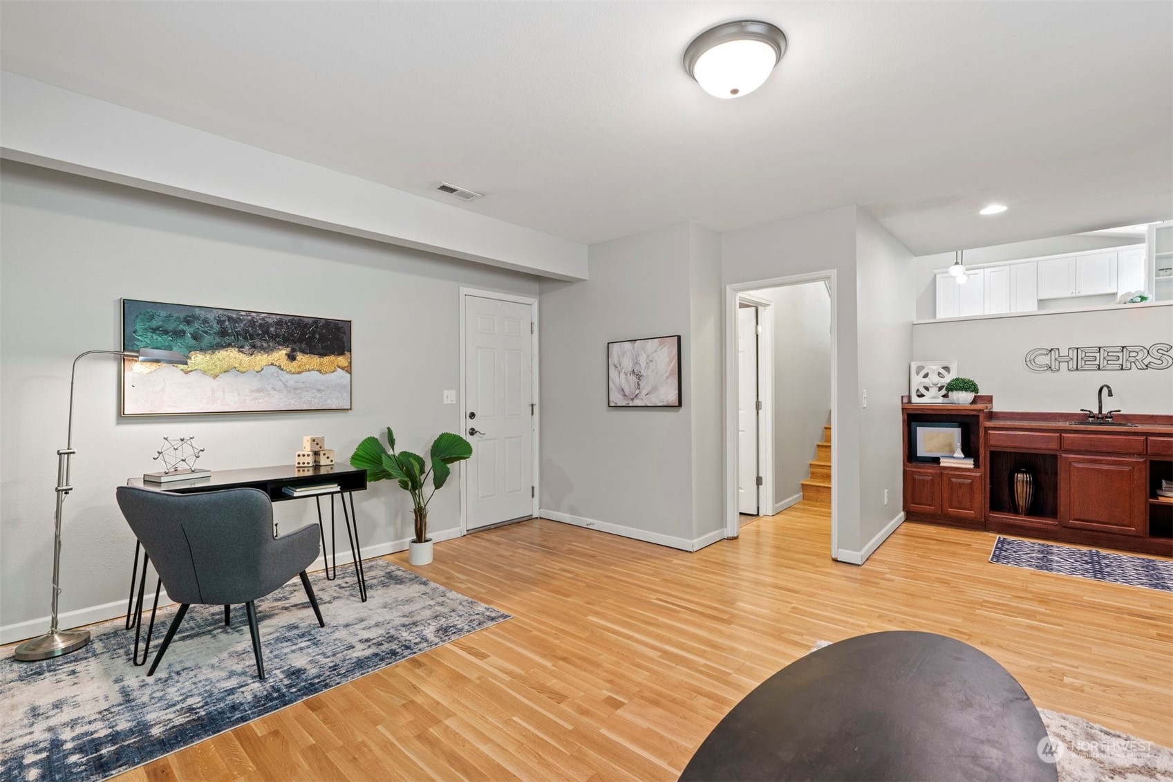 27403 Northeast 30th Way Redmond, WA 98053 - Photo 11 of 34 a bedroom with furniture and a wooden floor