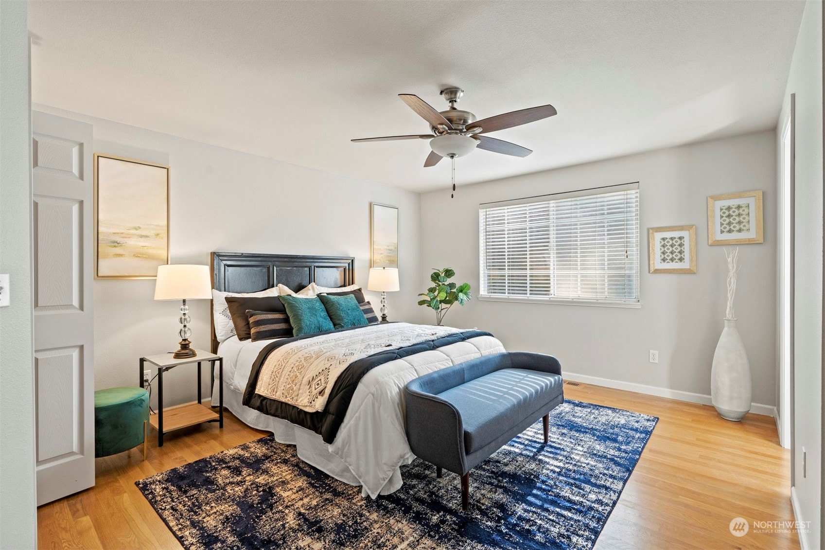 27403 Northeast 30th Way Redmond, WA 98053 - Photo 14 of 34 a bedroom with a bed rug and wooden floor