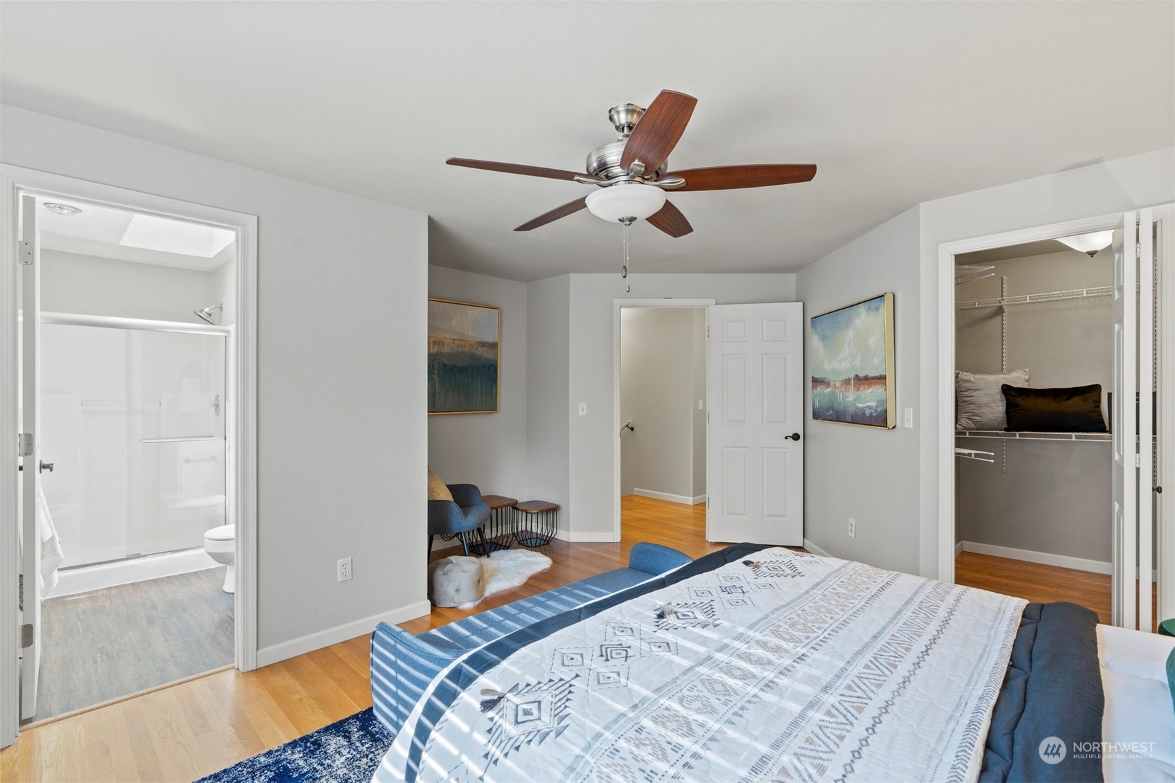 27403 Northeast 30th Way Redmond, WA 98053 - Photo 16 of 34 a bedroom with a bed and a chandelier
