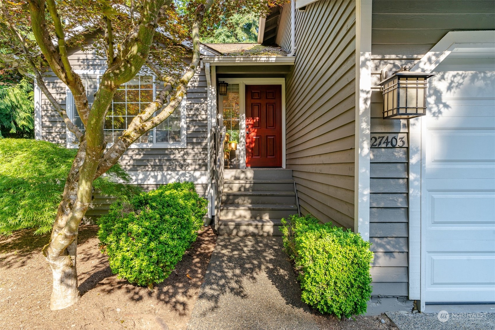27403 Northeast 30th Way Redmond, WA 98053 - Photo 2 of 34 a front view of a house with a yard