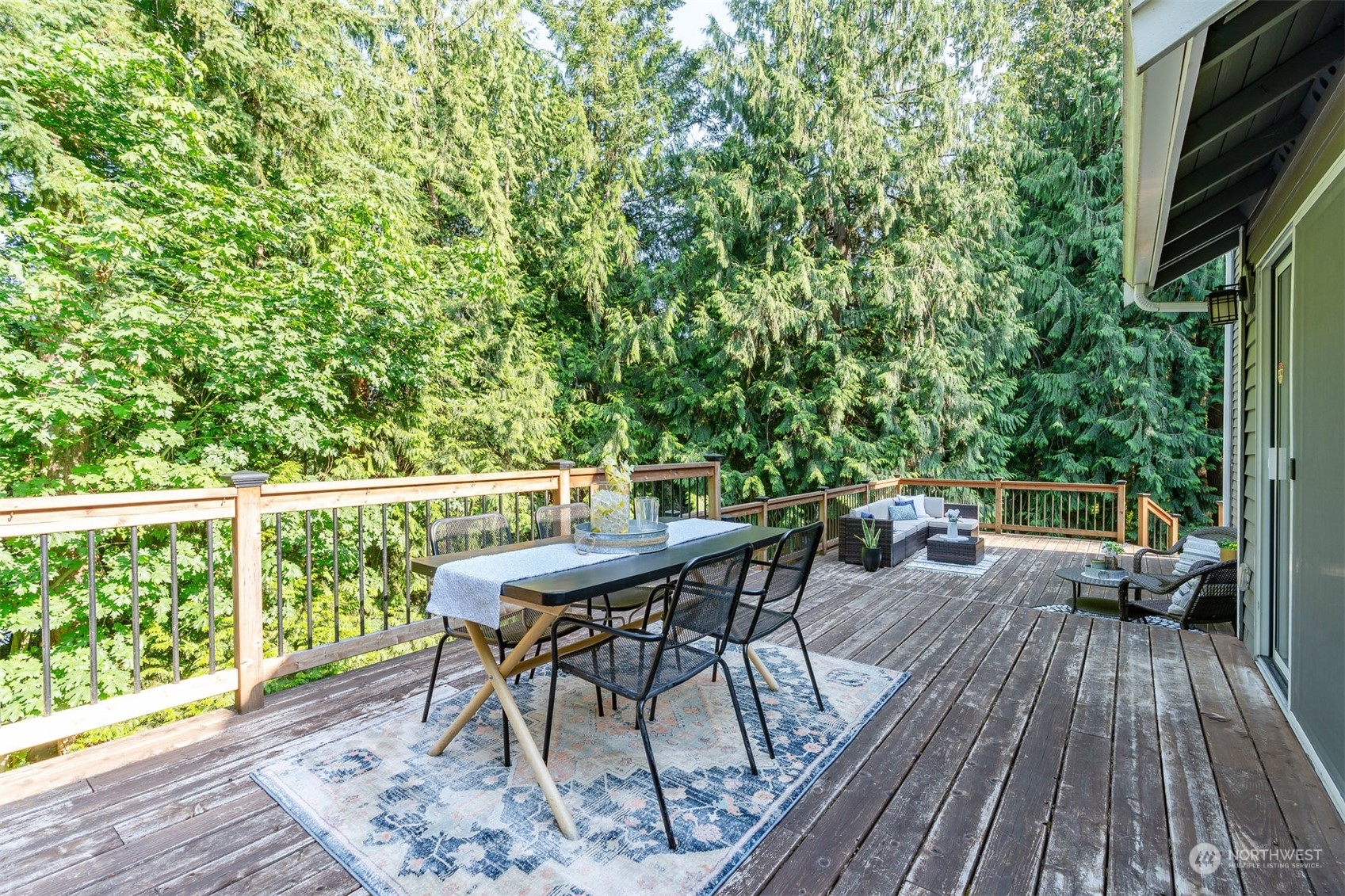 27403 Northeast 30th Way Redmond, WA 98053 - Photo 24 of 34 a balcony with wooden floor table and chairs