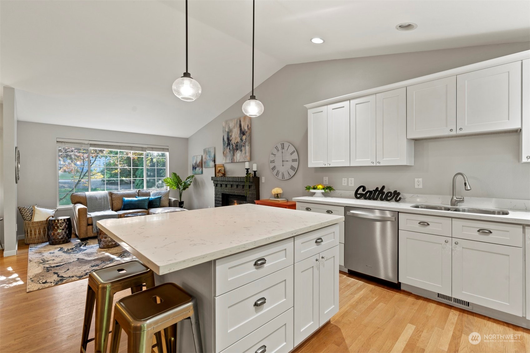 27403 Northeast 30th Way Redmond, WA 98053 - Photo 4 of 34 a kitchen that has a sink a stove and chairs
