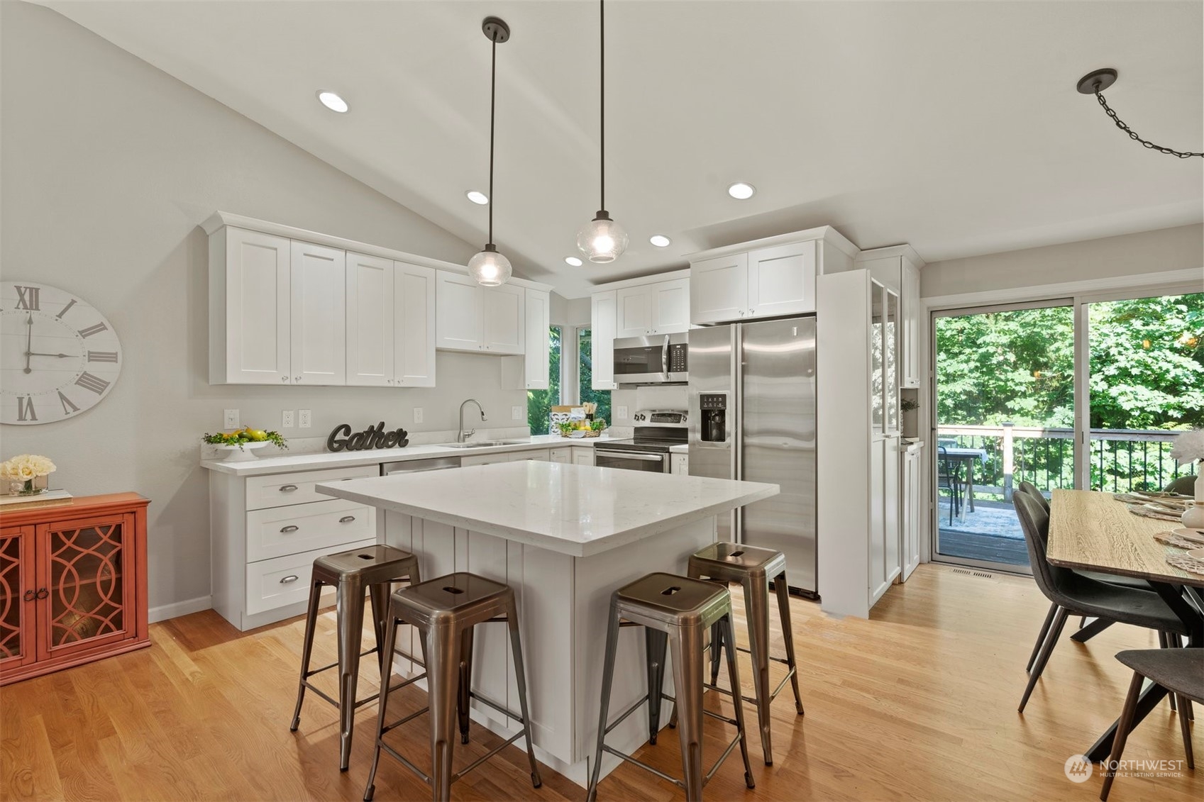 27403 Northeast 30th Way Redmond, WA 98053 - Photo 5 of 34 a kitchen with kitchen island a dining table and chairs