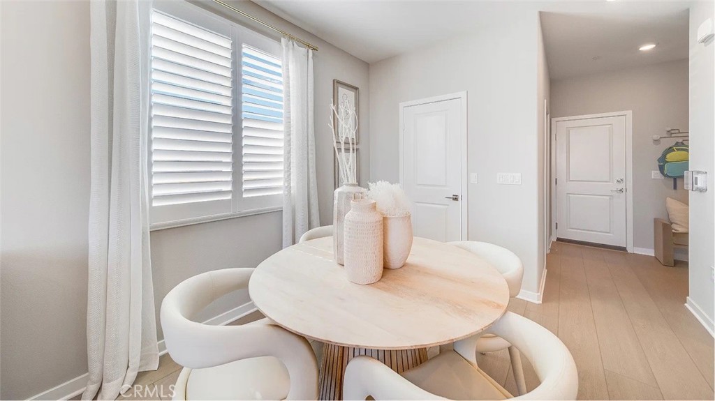 2581 Cloudview Privado Ontario, CA 91761 - Photo 5 of 19 a dining room with furniture and wooden floor