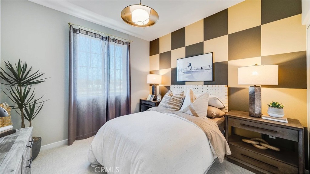 2581 Cloudview Privado Ontario, CA 91761 - Photo 6 of 19 a bedroom with a large bed and a potted plant