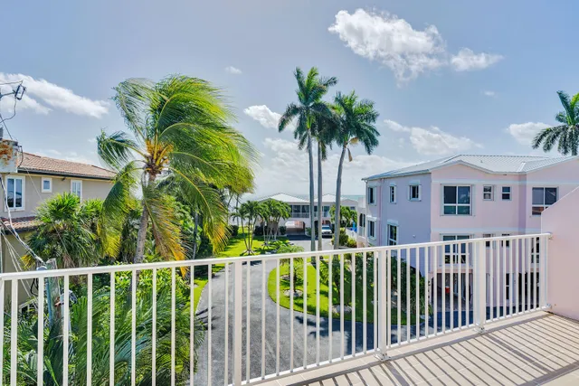 a view of a house with a small yard and plants