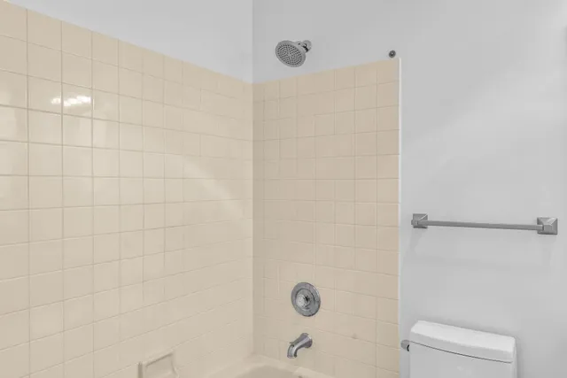 a bathroom with a shower and a bathtub