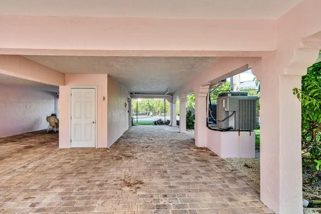 a view of a porch with a backyard space and garden