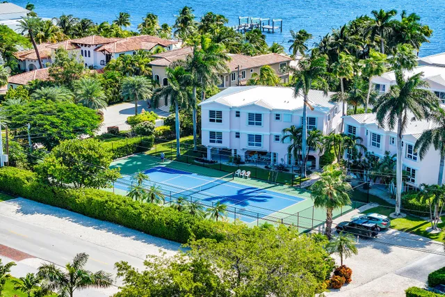 an aerial view of a house with a yard and garden