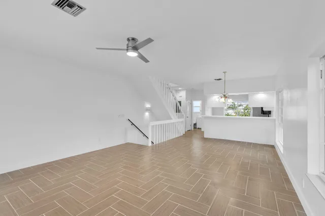 a view of a kitchen with a sink and cabinets