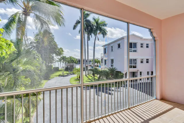 a view of a balcony with potted plants