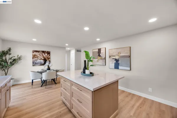 a view of kitchen island with wooden floor