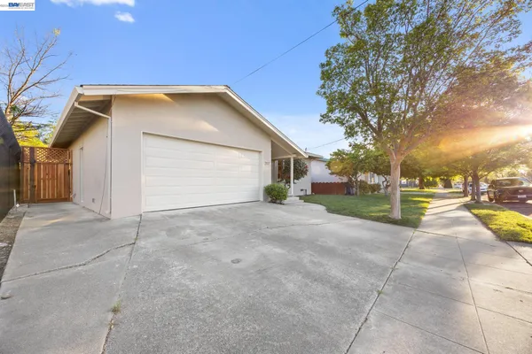 a view of a house with a yard and garage