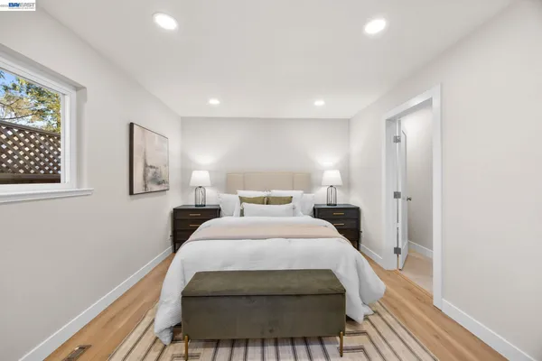 a bed room with a bed and a lamp