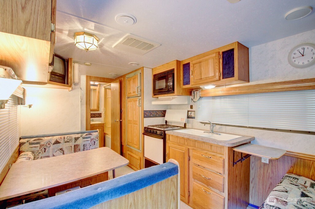 106 Goldrush Road Deming, WA 98244 - Photo 12 of 35 a kitchen with a sink stove and refrigerator
