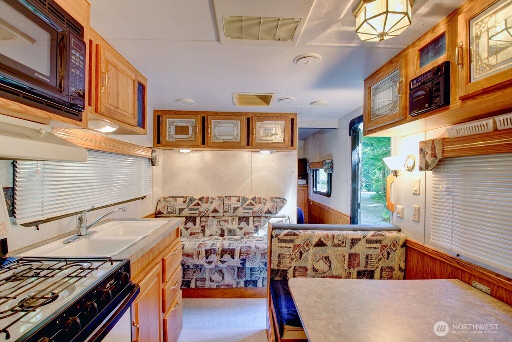 106 Goldrush Road Deming, WA 98244 - Photo 14 of 35 a kitchen with a stove and a cabinets