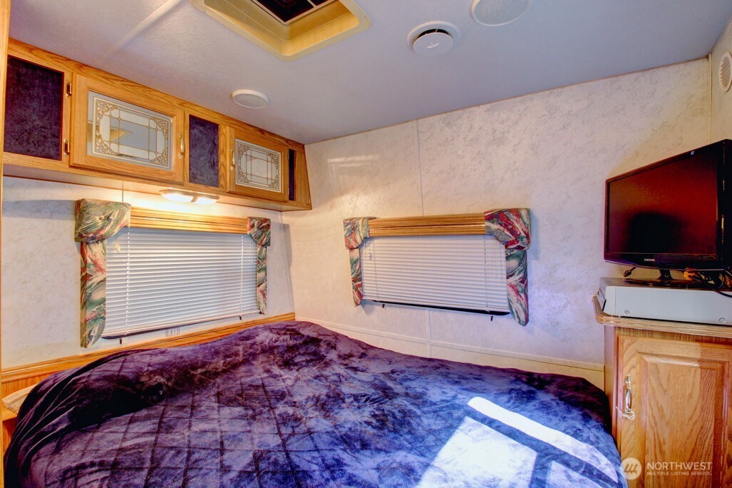 106 Goldrush Road Deming, WA 98244 - Photo 15 of 35 a bedroom with bed and flat screen tv