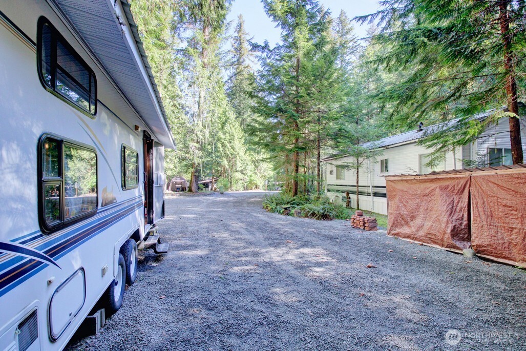 106 Goldrush Road Deming, WA 98244 - Photo 20 of 35 a view of a house with backyard and trees