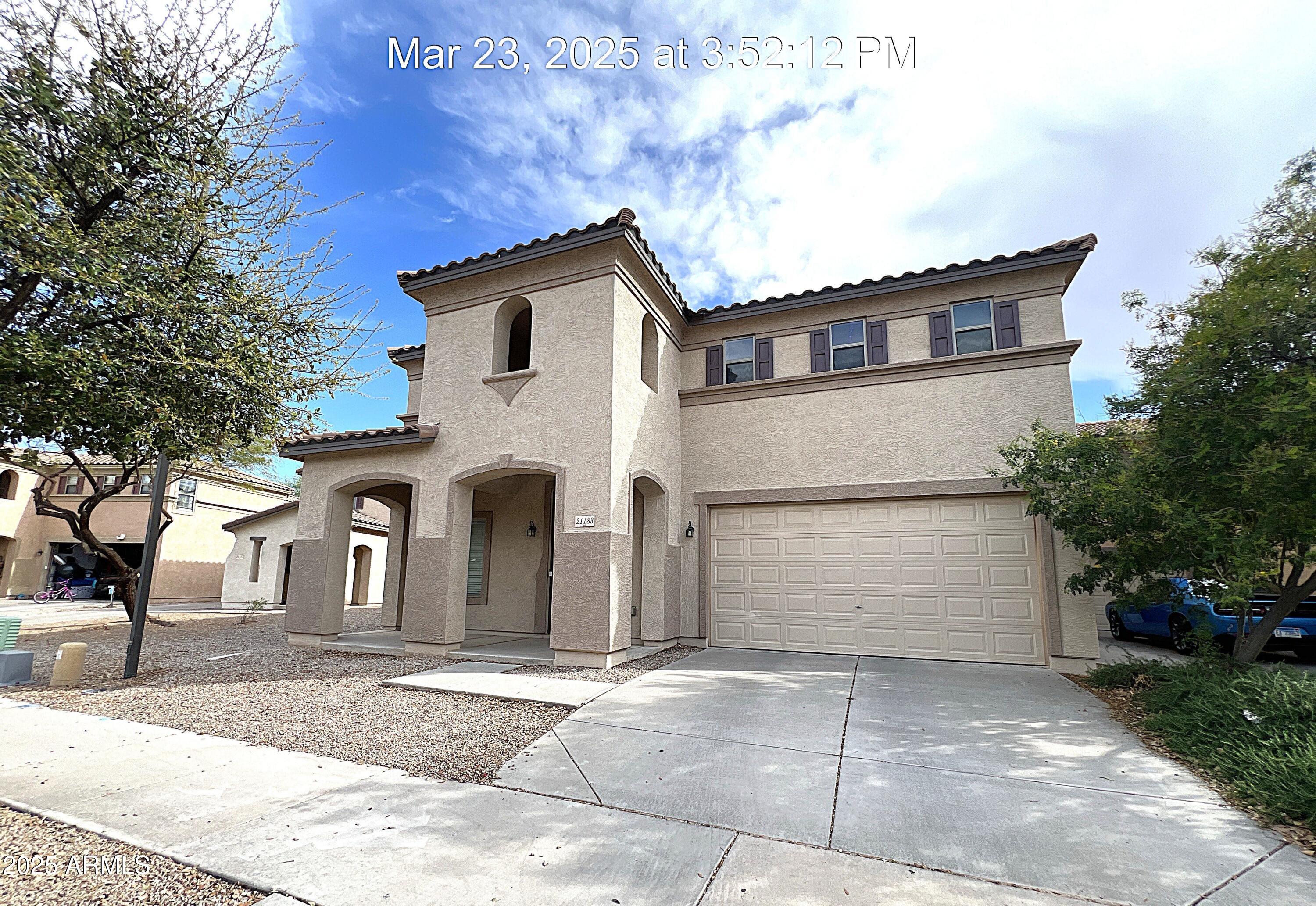 21183 East Avenida Del Valle Queen Creek, AZ 85142 - Photo 1 of 29 a front view of a house with a yard and garage