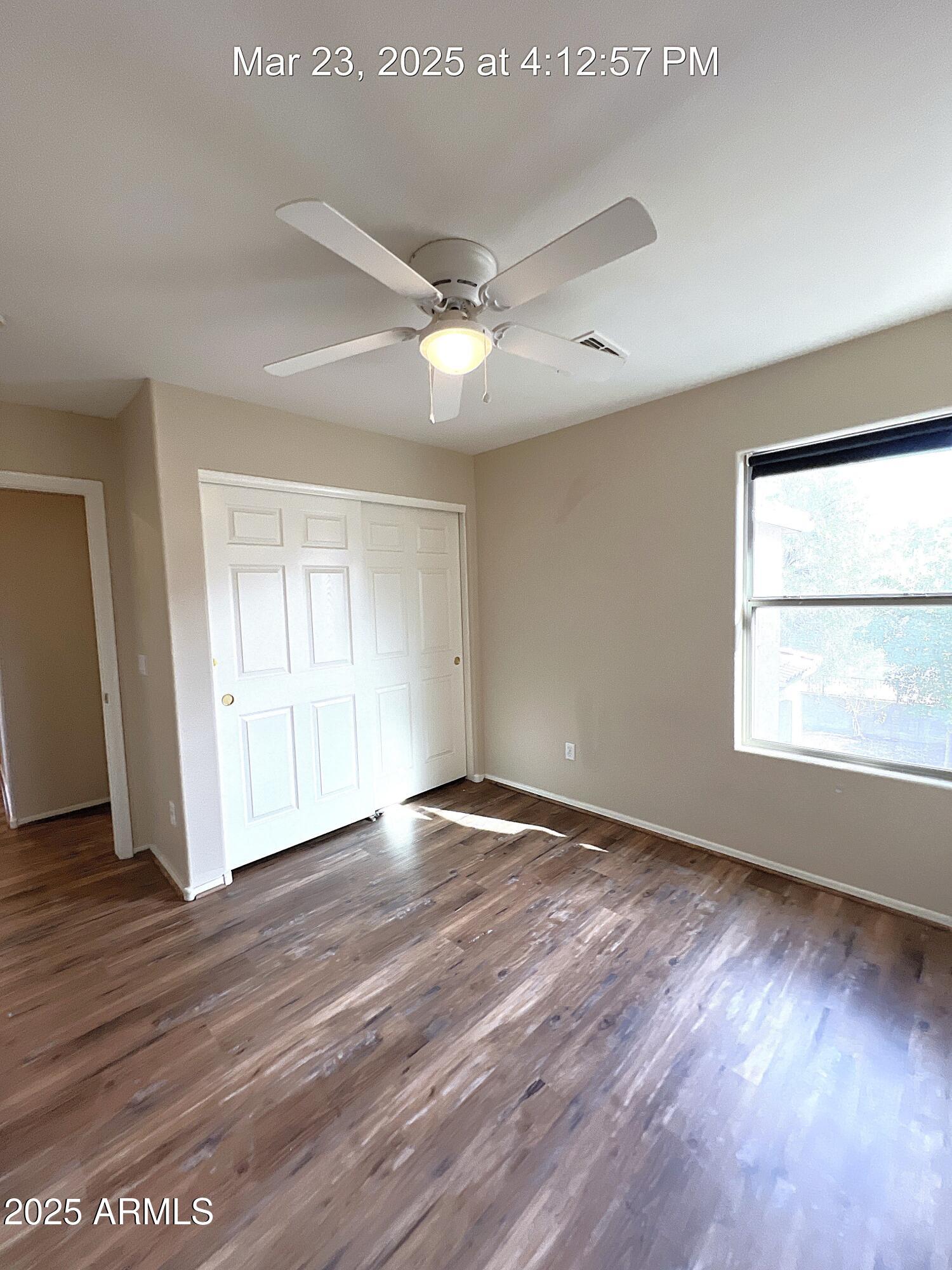 21183 East Avenida Del Valle Queen Creek, AZ 85142 - Photo 24 of 29 an empty room with wooden floor and windows