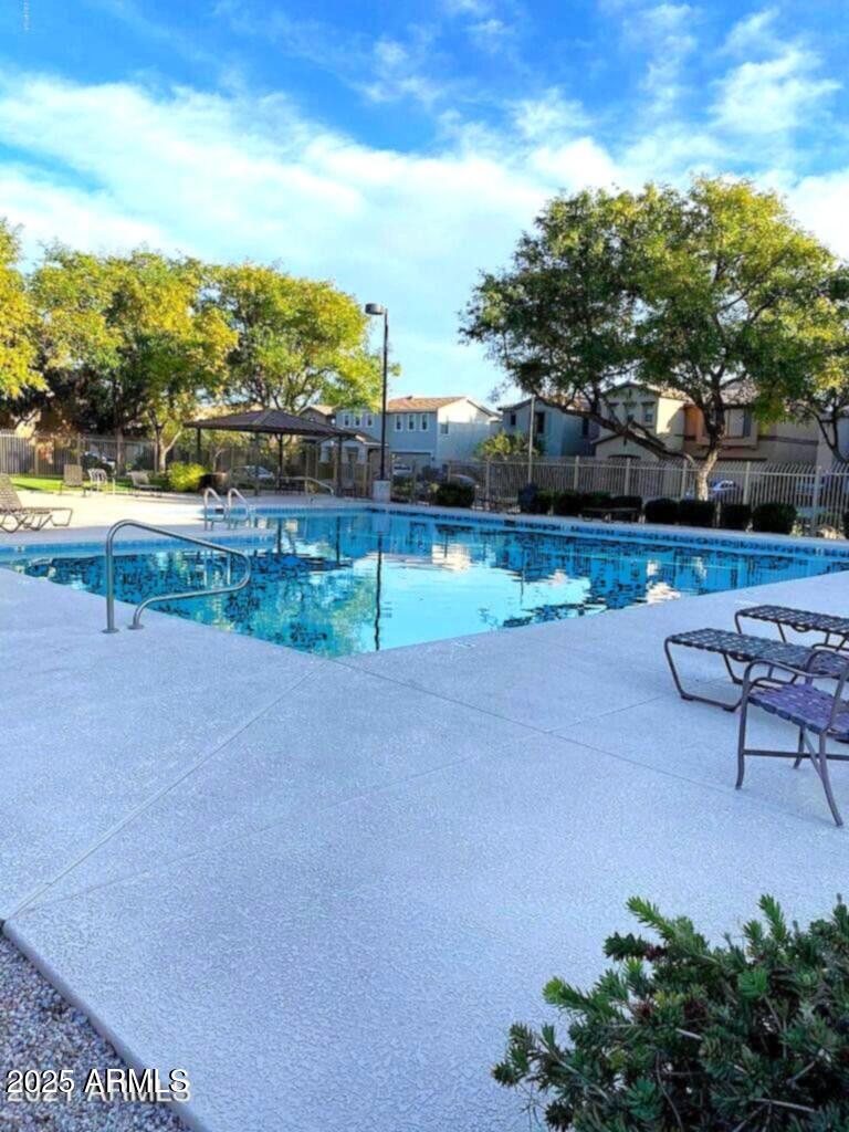 21183 East Avenida Del Valle Queen Creek, AZ 85142 - Photo 6 of 29 a view of a road with a yard