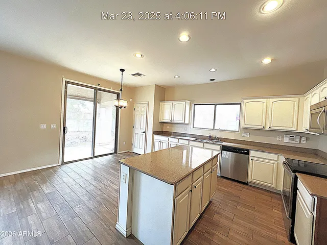 a kitchen with a refrigerator sink and microwave