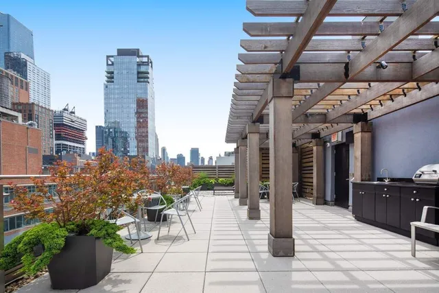 a front view of a building with potted plants