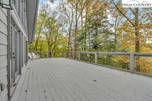 a view of a balcony with wooden floor