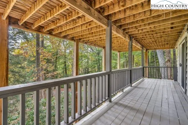 a view of balcony with wooden floor