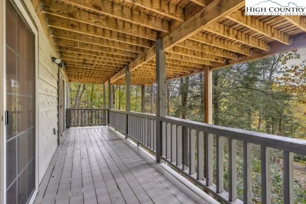 a view of balcony with wooden floor