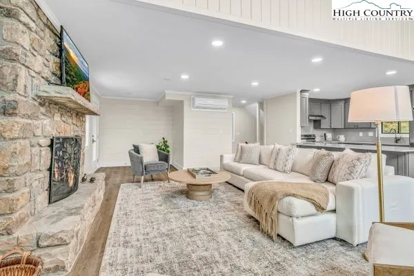 a living room with furniture and a fireplace