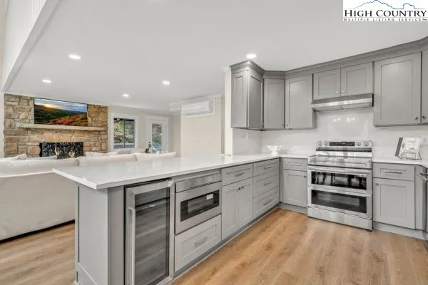 a kitchen with granite countertop a sink and white stainless steel appliances