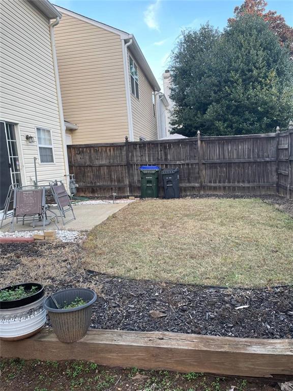 89 Regency Road Alpharetta, GA 30022 - Photo 17 of 17 a view of a backyard with plants and trees