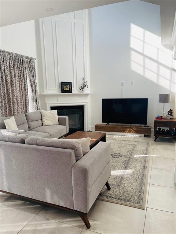 89 Regency Road Alpharetta, GA 30022 - Photo 4 of 17 a living room with furniture and a fireplace