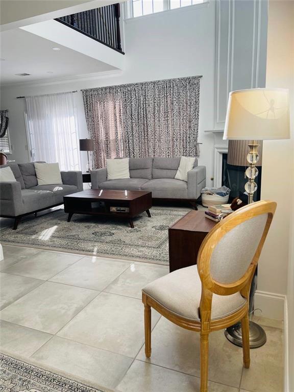 89 Regency Road Alpharetta, GA 30022 - Photo 5 of 17 a living room with furniture and a fireplace