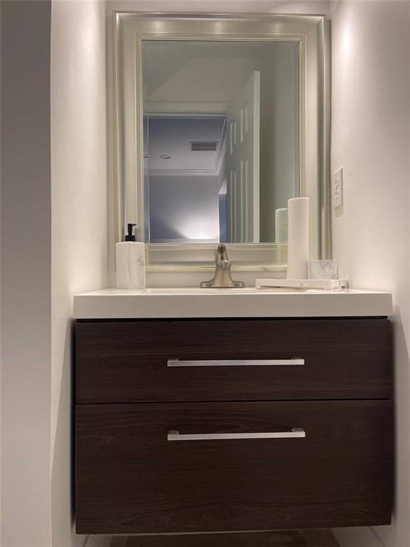 89 Regency Road Alpharetta, GA 30022 - Photo 7 of 17 a bathroom with a sink vanity and mirror