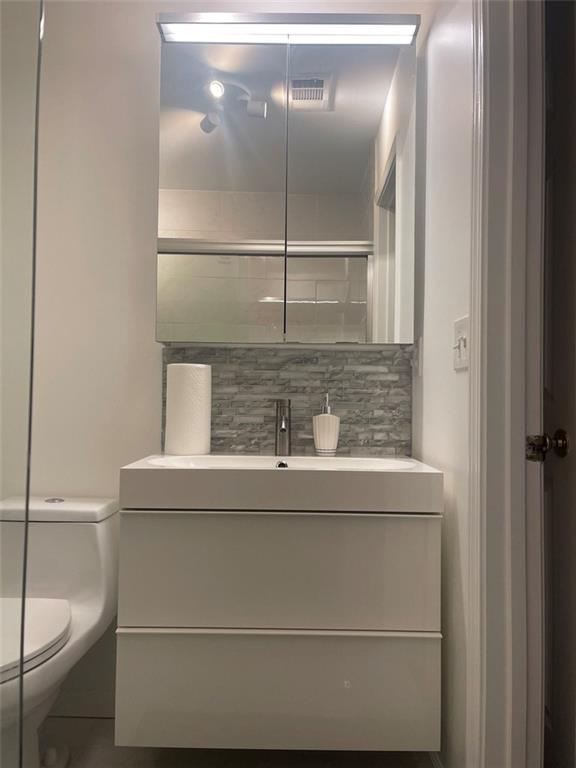 89 Regency Road Alpharetta, GA 30022 - Photo 10 of 17 a bathroom with a sink and mirror