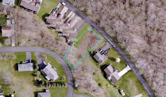 an aerial view of a house with a swimming pool