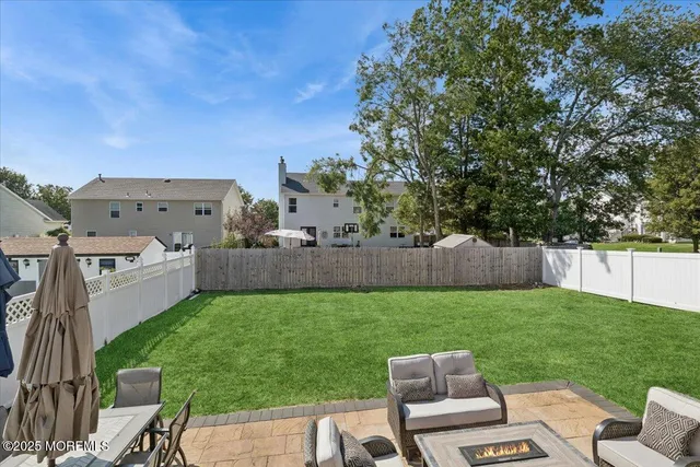 a view of a backyard with furniture