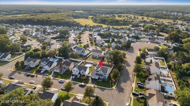 an aerial view of residential building and lake