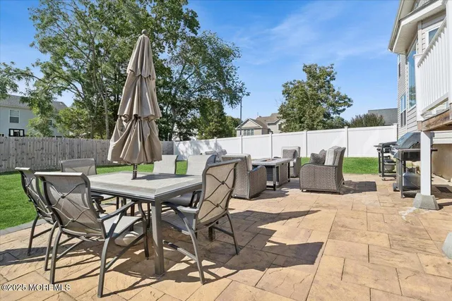 a front view of a house with a garden and yard