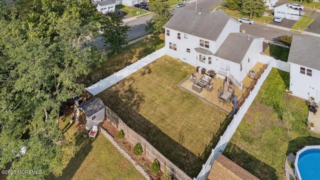 an aerial view of a house with outdoor space