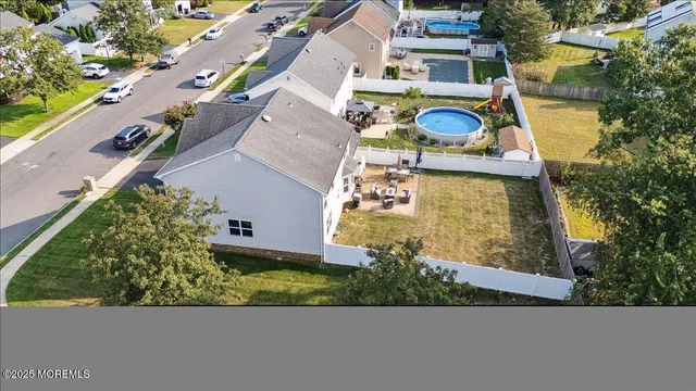 an aerial view of city and lake
