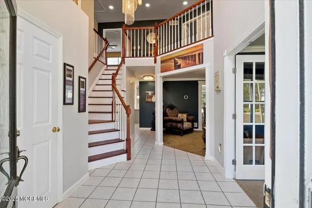 a view of entryway livingroom and hall with wooden floor