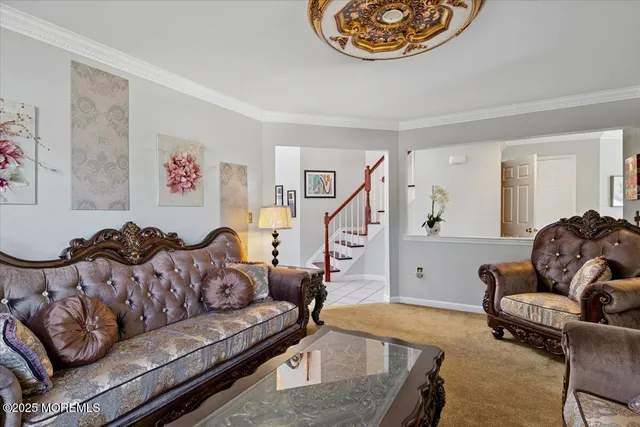 a living room with furniture and a rug
