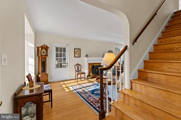a living room with wooden floor and furniture