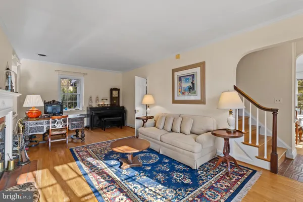 a living room with furniture and a rug