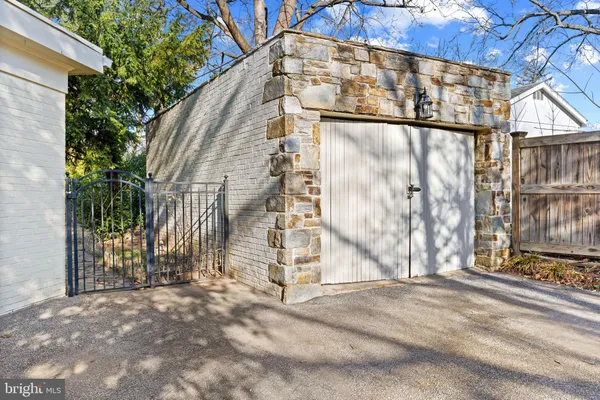a view of a street with house in the background