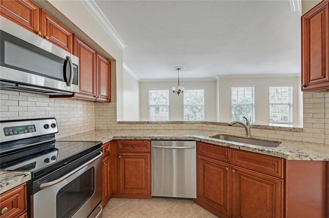 6348 West Sample Road, Unit 6348 Coral Springs, FL 33067 - Photo 3 of 25 Gourmet kitchen
